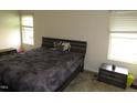 Comfortable bedroom with two windows, carpet and neutral color scheme at 2039 Alderman Way, Creedmoor, NC 27522