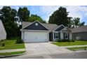 Inviting single-story home with two-car garage, sidewalk and lawn in a peaceful neighborhood at 2039 Alderman Way, Creedmoor, NC 27522