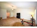 Spacious living room with a high ceiling, carpet, and ample natural light at 2039 Alderman Way, Creedmoor, NC 27522