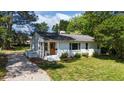 Attractive white brick home on a well-maintained lawn at 207 N Aiken St, Fuquay Varina, NC 27526