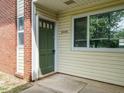 Close-up of a unit entrance door with address number and window at 2316 Champion Ct, Raleigh, NC 27606