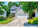 Charming two-story home with manicured lawn, attached two-car garage, and well-maintained landscaping at 2501 Springfield Park Dr, Raleigh, NC 27614