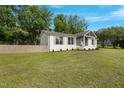 Charming home with a landscaped front yard, wooden privacy fence and beautiful curb appeal at 309 S Mckay Ave, Dunn, NC 28334