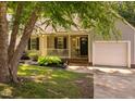 Charming home featuring a well-manicured lawn, covered porch and an attached one car garage at 358 Tillamook Dr, Wake Forest, NC 27587