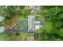 Aerial view of the property shows the house, driveway, and surrounding greenery at 3934 Hope Valley Rd, Durham, NC 27707