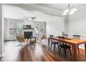 Spacious living room with a fireplace, hardwood floors, and modern furnishings at 412 Heritage Village Ln, Apex, NC 27502