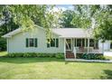 A cozy ranch home with a well-manicured lawn and lovely front porch is a must see! at 523 Edwards Rd, Henderson, NC 27537