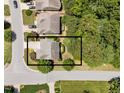 Aerial view of the home showcasing its position on a corner lot with mature trees and a spacious driveway at 5545 Moneta Ln, Apex, NC 27539