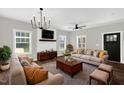 Comfortable living room featuring stylish decor, hardwood floors, and abundant natural light at 567 E Ridge Ave, Liberty, NC 27298
