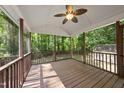 Spacious screened-in back porch with wooded views, perfect for outdoor relaxation and entertaining at 6009 Shadow Moss Cir, Raleigh, NC 27603