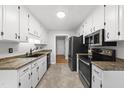 Efficient kitchen featuring ample cabinet space, modern appliances, and sleek countertops at 6009 Shadow Moss Cir, Raleigh, NC 27603