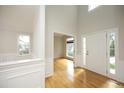 Bright foyer with hardwood floors and ample natural light streaming through the windows at 803 High Ct, Hillsborough, NC 27278