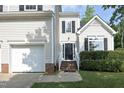 Home featuring a black front door with steps and manicured landscaping at 803 High Ct, Hillsborough, NC 27278
