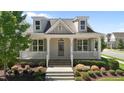Beautiful home boasting a classic front porch, landscaped yard and private residence signage at 1000 Groveview Wynd, Wendell, NC 27591