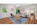 Cozy living room with stylish furnishings, ceiling fan, and access to outdoor patio at 106 Choptank Ct # B-2, Cary, NC 27513
