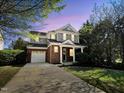 Beautiful two-story home with a brick and siding exterior, complemented by a well-manicured lawn at 1104 Pebblestone Drive, Durham, NC 27703