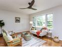 Cozy living room showcasing hardwood floors, stylish seating, and plenty of natural light at 114 Brenrose Cir, Durham, NC 27705