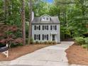 Charming two-story home with a well-maintained lawn and a long driveway at 15 Gray Fox Ct, Durham, NC 27713