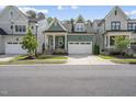 Inviting two-story home showcasing a lush green lawn, classic design, and a two-car garage at 167 Monteith Dr, Chapel Hill, NC 27516