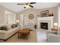 Cozy living room with fireplace, comfortable seating, and neutral tones for a welcoming atmosphere at 212 Southerby Dr, Garner, NC 27529