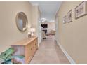 Hallway showcasing decorative accents, stylish flooring, and open flow to living spaces at 2310 Turning Pointe Way, Hillsborough, NC 27278