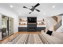 Cozy living room with a fireplace, built-in shelves, and a sliding glass door to the outdoors at 2713 Trifle Lane Ln, Wake Forest, NC 27587
