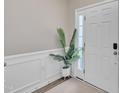 Bright entryway featuring fresh paint, and a stylish plant creates a welcoming first impression for guests at 342 Westgrove Ct, Durham, NC 27703