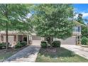 Charming townhome exterior with well-maintained landscaping and inviting facade in a suburban community at 342 Westgrove Ct, Durham, NC 27703
