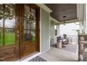 Cozy front porch with rocking chairs, stylish decor, and a welcoming entrance at 4105 Bankshire Ln, Raleigh, NC 27603