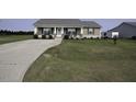 Well-maintained home boasting a spacious front yard and long driveway, perfect for Gathering and guests at 60 Falling Leaf Ln, Benson, NC 27504