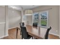 Light and bright dining area features hardwood floors and pendant lighting at 960 Sandyhill Rd, Wendell, NC 27591