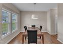 Cozy dining room with hardwood floors and lots of natural light at 960 Sandyhill Rd, Wendell, NC 27591