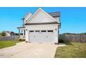 Charming home with a well-kept lawn and an attached two-car garage at 102 Williamson Place Dr, Princeton, NC 27569