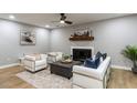 Stylish living room featuring a cozy fireplace, modern furniture, and neutral decor at 103 Summerlin Dr Dr, Chapel Hill, NC 27514