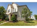 Landscaped home with lawn, bushes and tree on a corner lot with 'Coming Soon' sign at 1041 Pemberly Ave, Morrisville, NC 27560