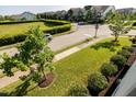 Overhead view of corner street in the neighborhood lined with manicured lawns and sidewalks at 1041 Pemberly Ave, Morrisville, NC 27560