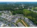 An aerial view of a townhouse community near downtown Raleigh, highlighting its proximity to the city at 1108 Renewal Pl, Raleigh, NC 27603