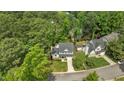 Aerial view of a beautifully landscaped home nestled among lush trees at 12117 Inglehurst Dr, Raleigh, NC 27613