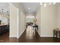 Inviting entryway with hardwood floors and views of the open-concept living space at 123 Turnstone Dr, Durham, NC 27703