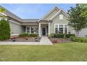 Charming front porch with lovely landscaping and an inviting entryway at 123 Turnstone Dr, Durham, NC 27703