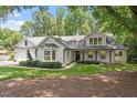 Charming single-story home with fresh, modern paint and a landscaped front yard at 124 Lord Ashley Rd, Raleigh, NC 27610