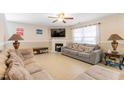 Spacious living room featuring a fireplace and neutral color scheme at 131 Botanical Ct, Bunnlevel, NC 28323
