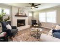 Inviting living room with a brick fireplace, stylish decor, and comfortable seating at 1612 Bethlehem Rd, Knightdale, NC 27545