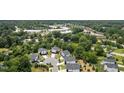 Overhead view of modern townhomes nestled within a lush, green community at 2225 Millbank Village Ct # 101, Raleigh, NC 27610