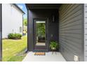 Stylish black front door with glass and a welcoming entrance, featuring modern design elements at 2225 Millbank Village Ct # 101, Raleigh, NC 27610