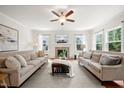 Spacious living room features neutral tones, large windows, fireplace, and comfortable seating at 2256 Toad Hollow Trl, Apex, NC 27502