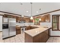 Well-equipped kitchen with stainless steel appliances, granite countertops, and ample cabinet space at 2708 Halfhitch Trl, Raleigh, NC 27615