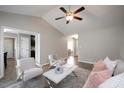 Inviting living room showcasing wood flooring, neutral decor, and a cozy seating arrangement at 308 E Quailwood Dr, Fuquay Varina, NC 27526