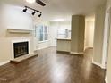 Inviting living room with cozy fireplace and modern flooring at 411 Gooseneck Dr # A1, Cary, NC 27513