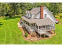 Aerial of home showing screened in porch and surrounding greenery at 4702 Pleasant Green Rd, Durham, NC 27705